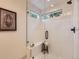 Modern shower featuring white vertical tile, frameless glass, built-in bench, and mosaic tile floor at 5206 S Meadow Lark Dr, Castle Rock, CO 80109