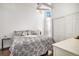 Bright bedroom with hardwood floors, ceiling fan, and a window to let in natural light at 8391 S Upham Way # 209, Littleton, CO 80128