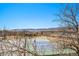 View of tennis court and mountain scenery from the community's recreation area at 8391 S Upham Way # 209, Littleton, CO 80128