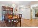 Well-lit dining room with hardwood floors and a decorative chandelier at 635 S Alton Way # 3B, Denver, CO 80247