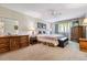 Bright main bedroom with a ceiling fan and large windows at 635 S Alton Way # 3B, Denver, CO 80247
