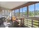 Bright sunroom with large windows and seating area at 635 S Alton Way # 3B, Denver, CO 80247