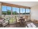 Enclosed sunroom with glass panels provides ample natural light at 635 S Alton Way # 3B, Denver, CO 80247
