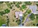 An aerial shot of the house showcasing its expansive lot, driveway, and landscaping at 18680 Knollwood Blvd, Monument, CO 80132