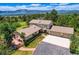Beautiful home with deck and well-manicured landscaping, featuring an attached garage at 18680 Knollwood Blvd, Monument, CO 80132