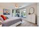 Cozy bedroom offering a bay window with seating, ceiling fan and neutral paint at 18680 Knollwood Blvd, Monument, CO 80132