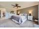 Comfortable main bedroom with plush carpet, a ceiling fan and tasteful decor at 18680 Knollwood Blvd, Monument, CO 80132