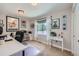 Well lit home office provides neutral paint, carpet, window with natural light, and tasteful decor at 18680 Knollwood Blvd, Monument, CO 80132