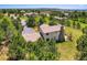 Spacious home featuring a chimney, roof and backyard surrounded by lush greenery and trees at 18680 Knollwood Blvd, Monument, CO 80132