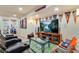Basement entertainment area features a TV, sports memorabilia, and comfortable seating at 11830 Snowshoe Dr, Parker, CO 80138