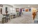 Spacious finished basement with multiple seating areas, a puzzle table, and wall decorations at 11830 Snowshoe Dr, Parker, CO 80138