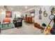 Finished basement boasts a sports-themed area, bar, and music space with instruments on display at 11830 Snowshoe Dr, Parker, CO 80138
