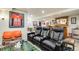 Finished basement with media and game area, furniture, and decor at 11830 Snowshoe Dr, Parker, CO 80138