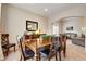 Elegant dining room featuring a wooden table, leather chairs, and large mirror at 11830 Snowshoe Dr, Parker, CO 80138