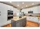 Spacious kitchen featuring granite countertops, stainless steel appliances, and ample cabinetry at 11830 Snowshoe Dr, Parker, CO 80138