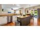 Well-lit kitchen with granite countertops, stainless steel appliances and an island at 11830 Snowshoe Dr, Parker, CO 80138