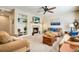 Comfortable living room with a fireplace, built-in shelving, and neutral décor at 11830 Snowshoe Dr, Parker, CO 80138