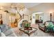 Open-concept living area featuring a staircase, dining room, and comfortable seating arrangement at 11830 Snowshoe Dr, Parker, CO 80138