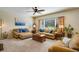 Inviting living room with neutral tones, plush seating, and large window at 11830 Snowshoe Dr, Parker, CO 80138