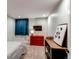 Basement bedroom with red dresser and a large panda print at 3448 Ghost Dance Dr, Castle Rock, CO 80108