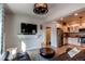 Cozy basement living room with sectional sofa and a large flat-screen TV at 3448 Ghost Dance Dr, Castle Rock, CO 80108