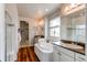 Double vanity bathroom with soaking tub and shower at 3448 Ghost Dance Dr, Castle Rock, CO 80108