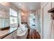 Elegant bathroom with soaking tub, double vanity, and walk-in shower at 3448 Ghost Dance Dr, Castle Rock, CO 80108