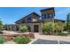 Modern community center with stone accents and ample parking at 3448 Ghost Dance Dr, Castle Rock, CO 80108