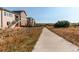 Scenic walking path in the community, near homes and open space at 3448 Ghost Dance Dr, Castle Rock, CO 80108