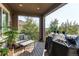 Relaxing deck with seating area and views of the backyard at 3448 Ghost Dance Dr, Castle Rock, CO 80108