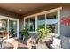 Covered deck with seating area, offering views of the neighborhood at 3448 Ghost Dance Dr, Castle Rock, CO 80108