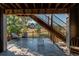 Private deck with seating area and stairs leading down to the backyard at 3448 Ghost Dance Dr, Castle Rock, CO 80108