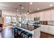 Spacious kitchen with island, stainless steel appliances, and hardwood floors at 3448 Ghost Dance Dr, Castle Rock, CO 80108