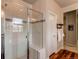 Walk-in shower with glass enclosure and bench at 3448 Ghost Dance Dr, Castle Rock, CO 80108