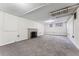 Spacious unfinished basement featuring neutral carpet and fireplace, perfect for customization at 1965 Jasmine St, Denver, CO 80220