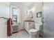 Bathroom with a toilet, shower, and vanity featuring a sink at 1965 Jasmine St, Denver, CO 80220