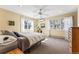Bright bedroom features neutral carpet and light yellow walls at 1965 Jasmine St, Denver, CO 80220