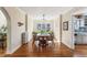 Formal dining room boasts hardwood floors and flows into the adjacent kitchen at 1965 Jasmine St, Denver, CO 80220