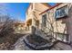 Charming home exterior showcasing well maintained landscape with a stone walkway leading to a covered porch at 1965 Jasmine St, Denver, CO 80220