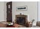 Close up shot of living room fireplace featuring a decorative grate and mantle at 1965 Jasmine St, Denver, CO 80220