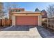 Detached two car garage and concrete driveway, surrounded by wooden privacy fence at 1965 Jasmine St, Denver, CO 80220