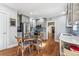 Stylish kitchen featuring stainless steel appliances, modern cabinetry, and an adjacent dining area at 1965 Jasmine St, Denver, CO 80220
