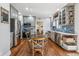 Well-lit kitchen with stainless steel appliances, updated cabinetry, and a functional layout at 1965 Jasmine St, Denver, CO 80220