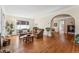 Inviting living room with hardwood floors, archway, and plenty of natural light at 1965 Jasmine St, Denver, CO 80220