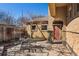 Inviting backyard patio complete with ample seating, mature trees, and a private entry at 1965 Jasmine St, Denver, CO 80220