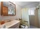 A full bath features a shower-tub combo and a functional single-sink vanity at 9430 Osceola St, Westminster, CO 80031
