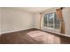 Sunlit bedroom with hardwood floors and neutral walls at 4643 S Vivian Ct, Morrison, CO 80465