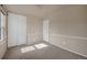 Bedroom features neutral paint and carpet, large closets, and good natural light at 4643 S Vivian Ct, Morrison, CO 80465