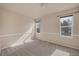 Spacious bedroom features neutral paint and carpet with generous natural light at 4643 S Vivian Ct, Morrison, CO 80465