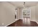 Hardwood floors in dining area lead to adjacent spaces filled with natural light, neutral wall paint at 4643 S Vivian Ct, Morrison, CO 80465